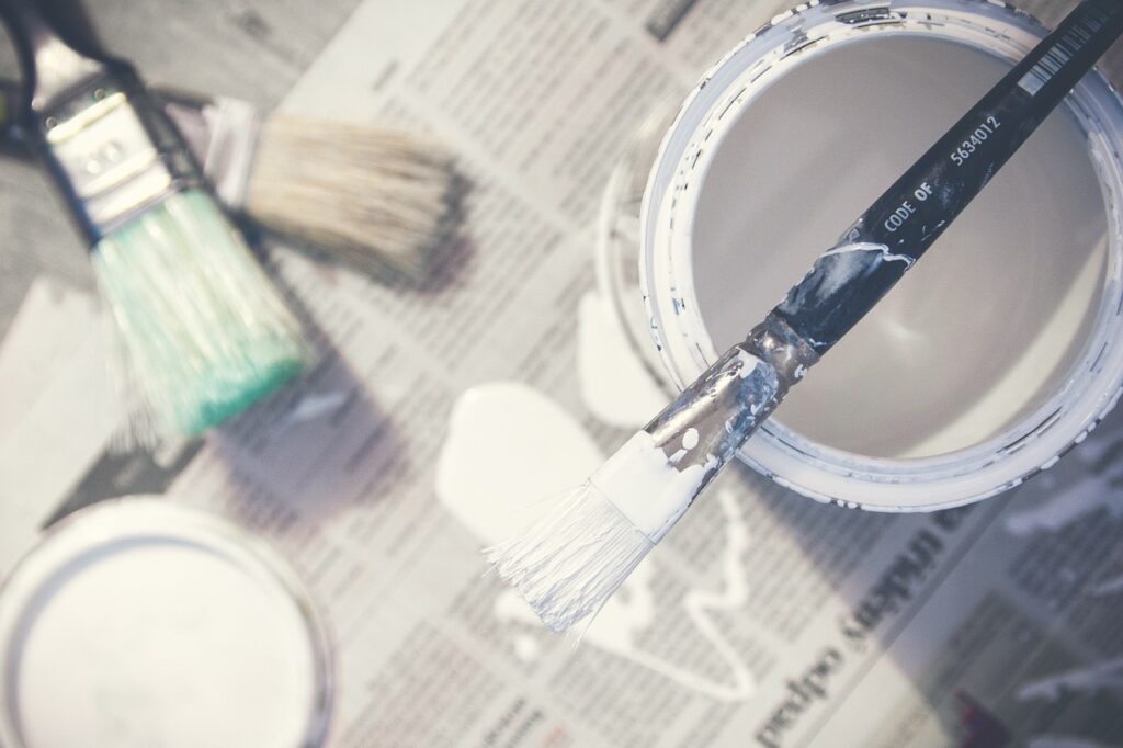 Paint brushes and a can of paint